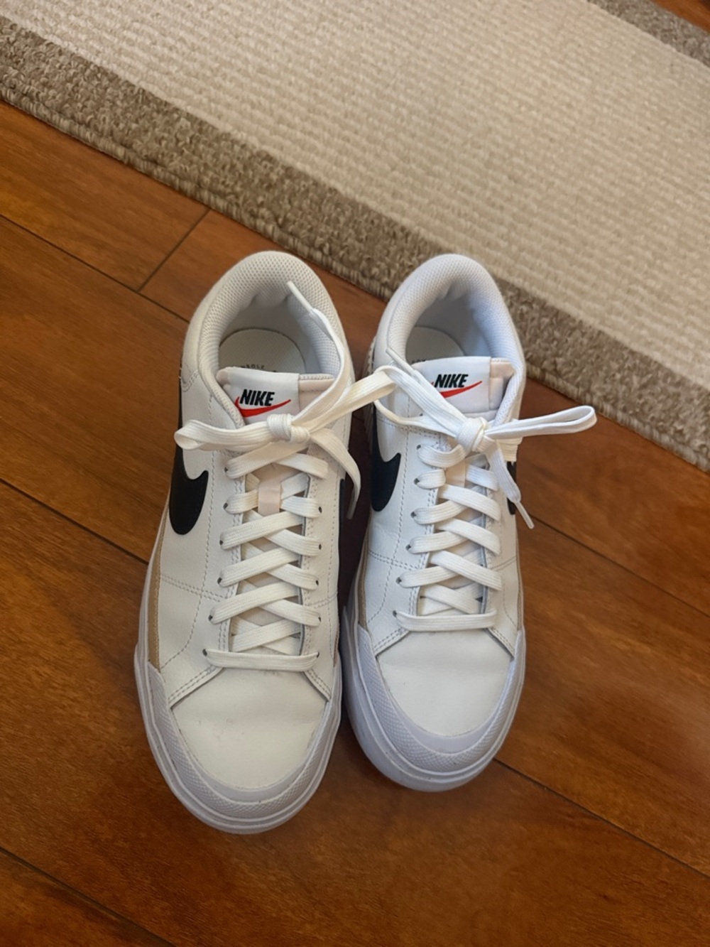 Nike White Sneakers with Black Swoosh Low-Top